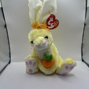 Ty Beanie Baby. Nibblies the Yellow Easter Rabbit holding a carrot. Born in 2002